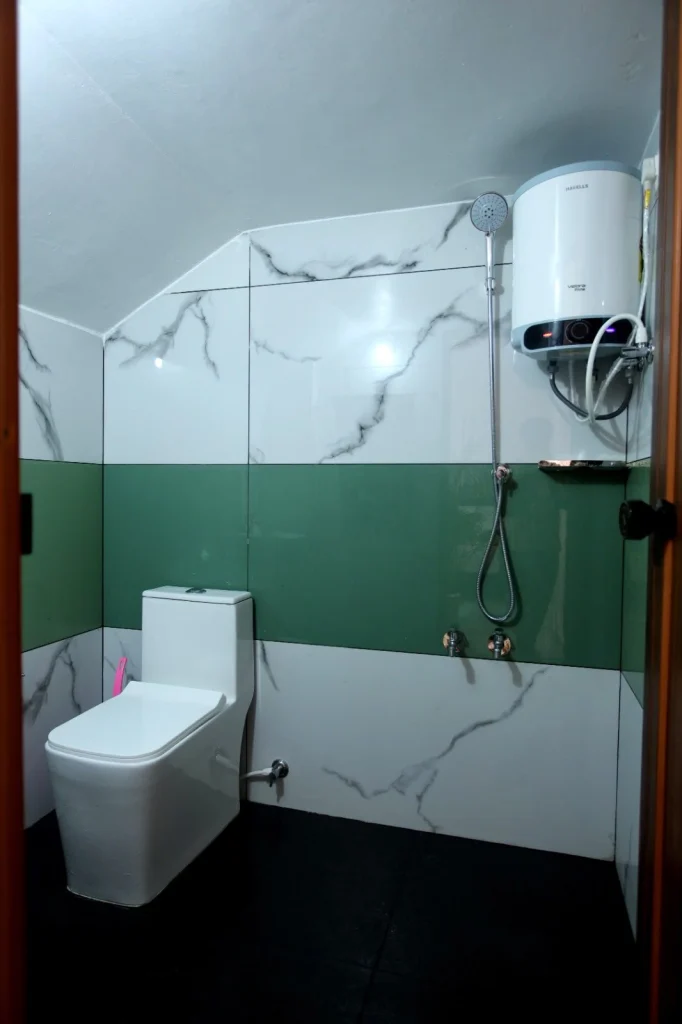 Second bathroom with a walk-in shower and water heater