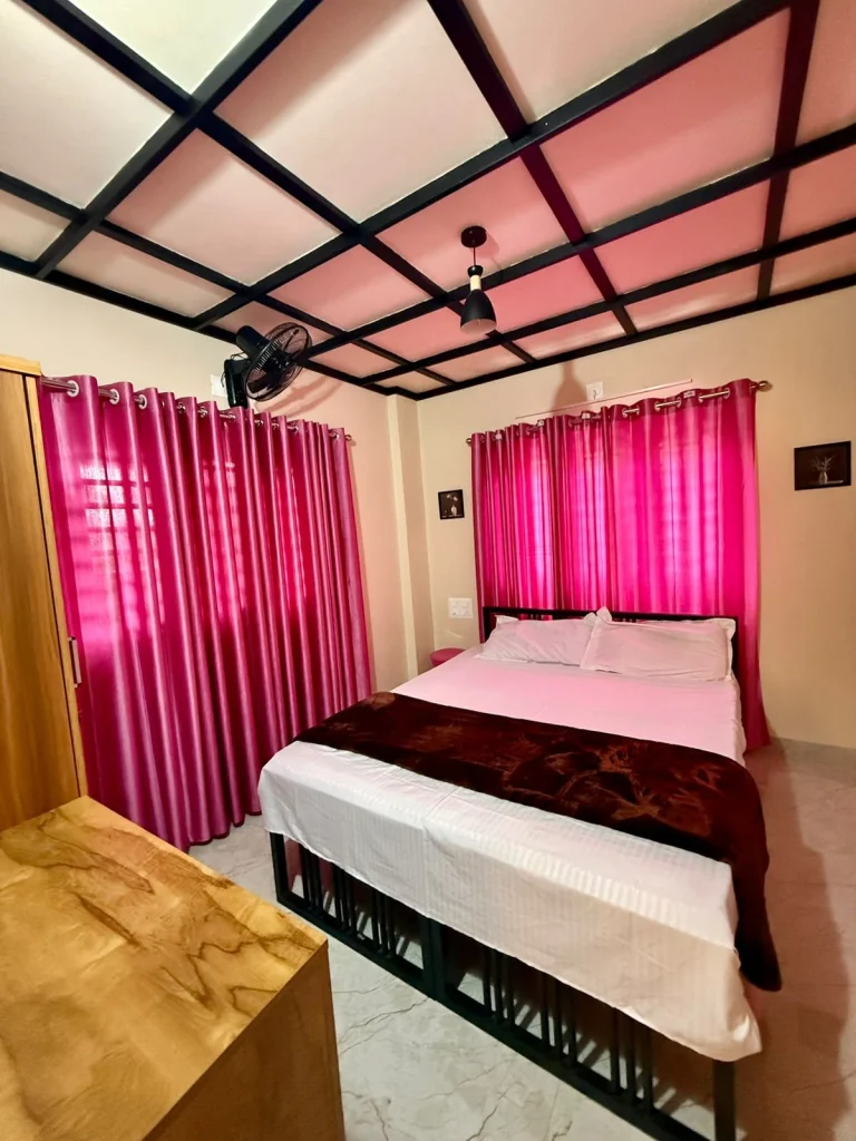 Bedroom with a double bed, seen from the doorway