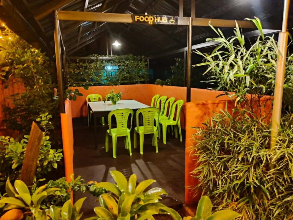 The covered outdoor dining area at night