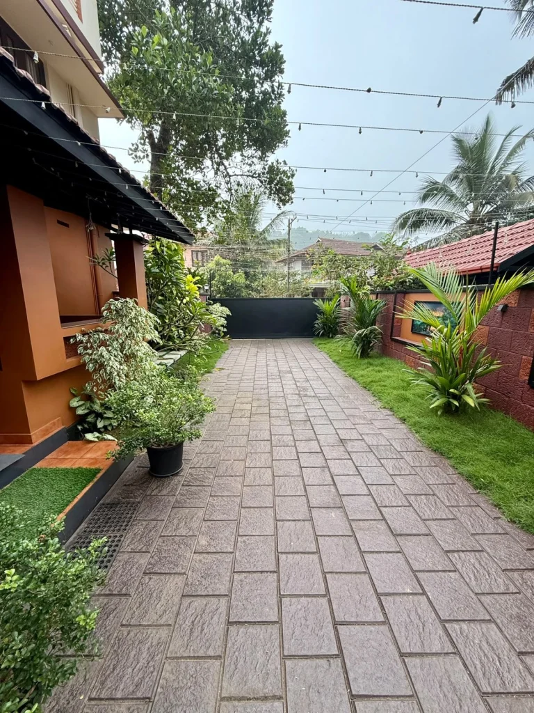 Paved path running along the house and garden