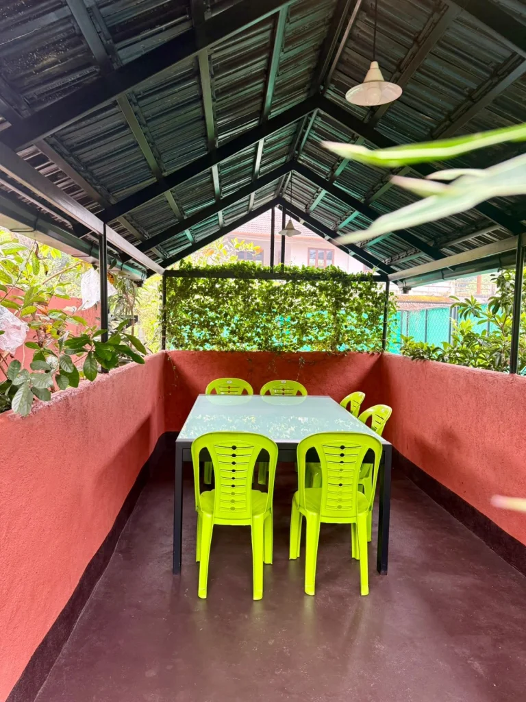 Table and chairs in the covered outdoor dining area