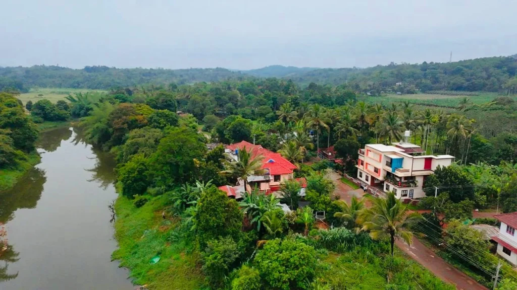 Aerial view of the Kabini River winding past the village